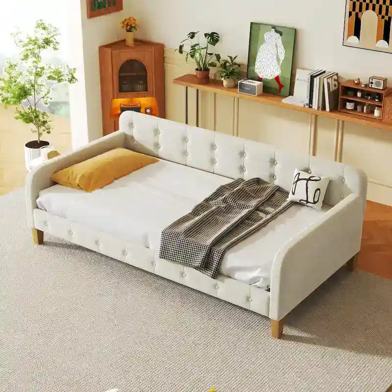 Diván tapizado de terciopelo con estructura de madera y reposabrazos