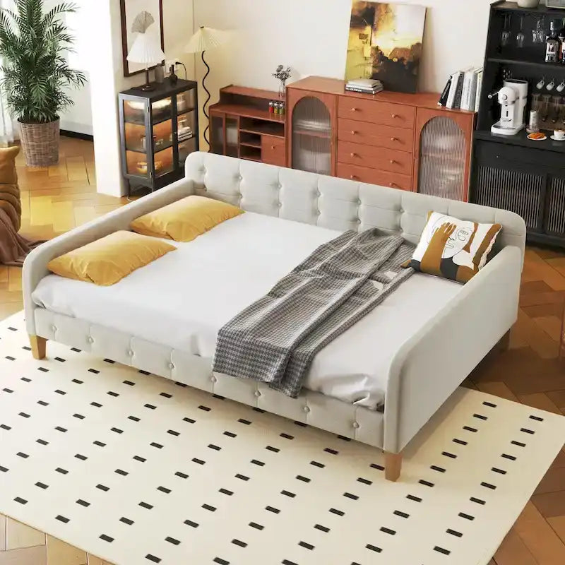 Diván tapizado de terciopelo con estructura de madera y reposabrazos