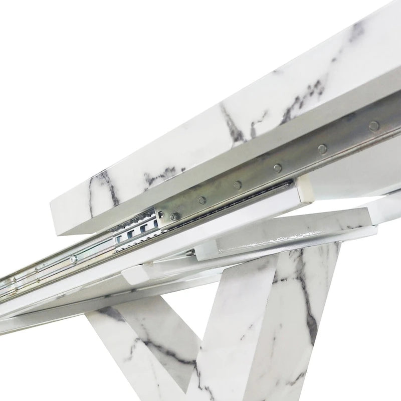 Mesa de comedor extensible con aspecto de mármol y pedestal en forma de X