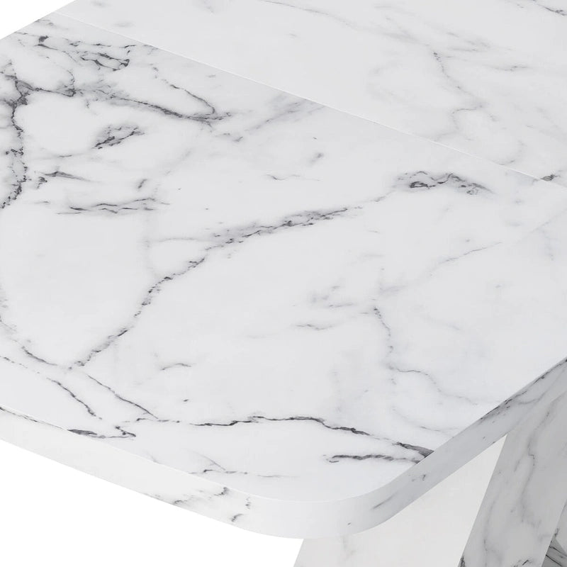 Mesa de comedor extensible con aspecto de mármol y pedestal en forma de X