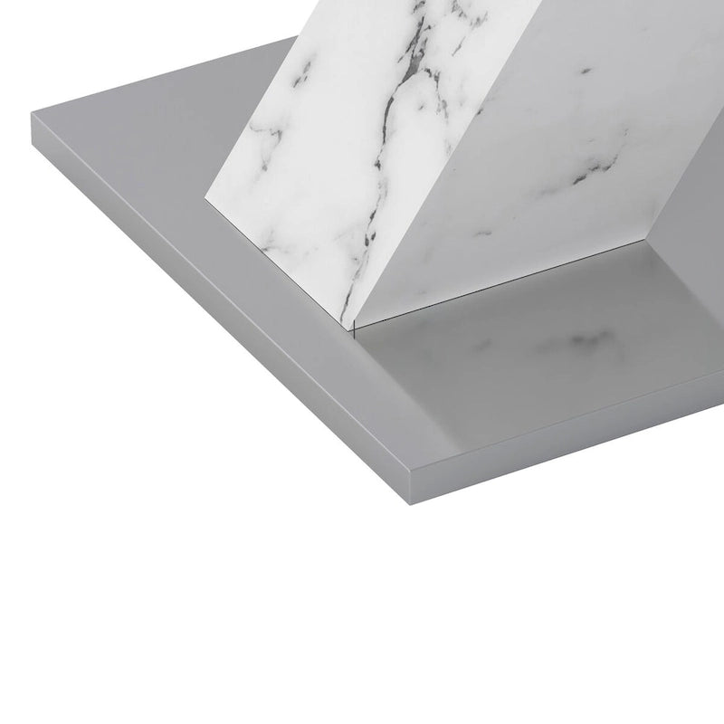 Mesa de comedor extensible con aspecto de mármol y pedestal en forma de X